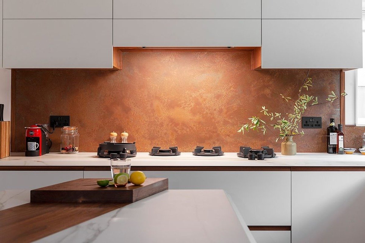 Seamless Brushed Amber Splashback with Socket Cutouts
